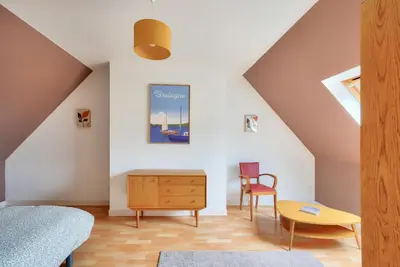 Coin salon dans l'établissement Maison pour 4 adultes, 1 enfant à 200m de la plage