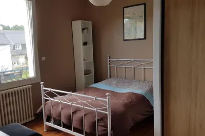 Un ou plusieurs lits dans un hébergement de l'établissement Le Chalet de l'Odet