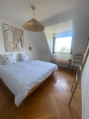Un ou plusieurs lits dans un hébergement de l'établissement Villa Bonheur