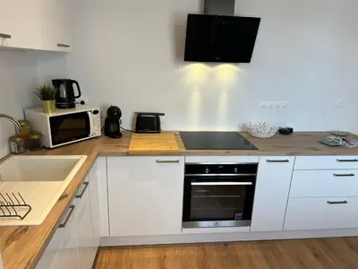 Cuisine ou kitchenette dans l'établissement T2 de Charme Rénové à Beg-Meil, À 250m de la Plage
