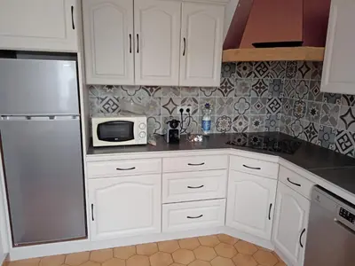 Cuisine ou kitchenette dans l'établissement Maison Pays Fouesnantais