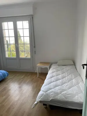 Un ou plusieurs lits dans un hébergement de l'établissement Villa vue mer