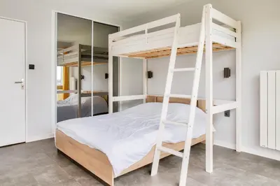 Un ou plusieurs lits dans un hébergement de l'établissement Vue mer - À 160m de la plage - Appartement pour 4