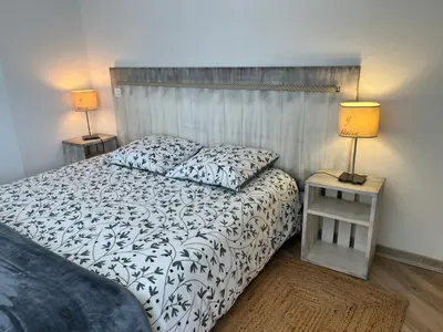 Un ou plusieurs lits dans un hébergement de l'établissement Appartement T3 avec piscine en résidence 4 étoiles