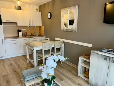 Cuisine ou kitchenette dans l'établissement Appartement T3 avec piscine en résidence 4 étoiles