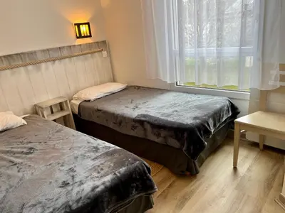 Un ou plusieurs lits dans un hébergement de l'établissement Appartement T3 avec piscine en résidence 4 étoiles