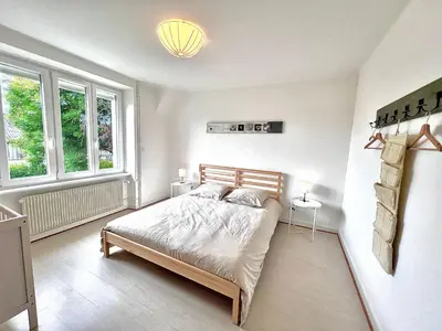 Un ou plusieurs lits dans un hébergement de l'établissement Sublime maison familiale refaite à neuf Quartier très calme verdoyant