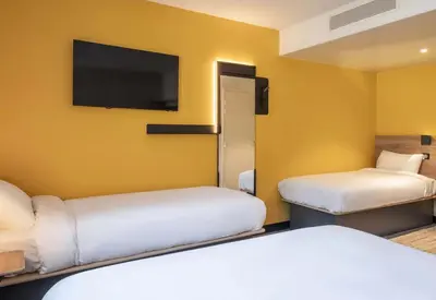 Un ou plusieurs lits dans un hébergement de l'établissement B&B HOTEL Brest Porte de Gouesnou