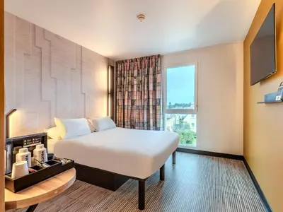 Un ou plusieurs lits dans un hébergement de l'établissement B&B HOTEL Brest Porte de Gouesnou
