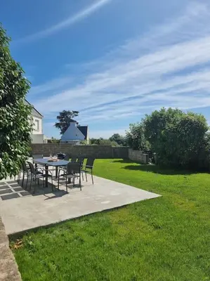 Jardin de l'établissement Maison familiale - 10pers - 3 étoiles - lumineuse et cosy - draps et serviettes inclus - parking - La Torche 9 min
