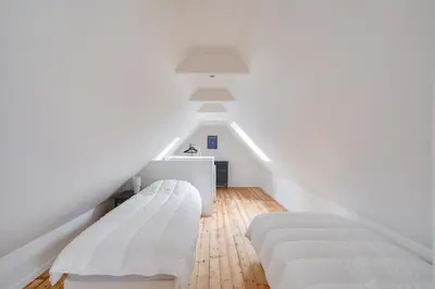 Un ou plusieurs lits dans un hébergement de l'établissement Jolie maison à la campagne pour 4