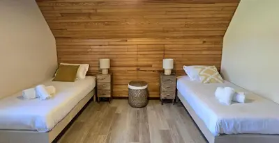 Un ou plusieurs lits dans un hébergement de l'établissement Maison vue mer Crozon - Jacuzzi - Sauna
