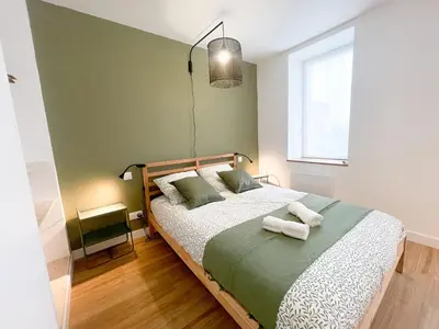 Un ou plusieurs lits dans un hébergement de l'établissement Le petit loft