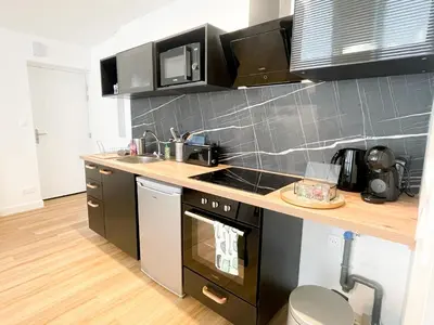 Cuisine ou kitchenette dans l'établissement Le petit loft