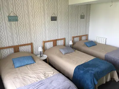 Un ou plusieurs lits dans un hébergement de l'établissement La légende Men Marz 1er étage- Centre-ville Brignogan-Plages , 300 m des plages