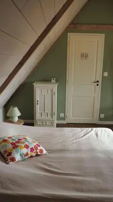 Un ou plusieurs lits dans un hébergement de l'établissement Ker Agak Maison vue mer panoramique pour 7 pers