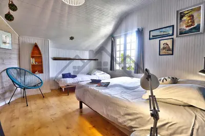 Un ou plusieurs lits dans un hébergement de l'établissement LocaLise - M20B - Ocean Lodge - Maison avec jardin clos - terrasse - plage à 400m - wifi inclus - draps inclus - animaux bienvenus
