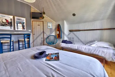 Un ou plusieurs lits dans un hébergement de l'établissement LocaLise - M20B - Ocean Lodge - Maison avec jardin clos - terrasse - plage à 400m - wifi inclus - draps inclus - animaux bienvenus