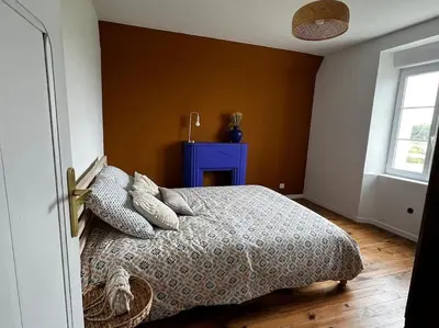 Un ou plusieurs lits dans un hébergement de l'établissement Maison Plouhinec Finistère 29 avec vue Mer et grand Jardin