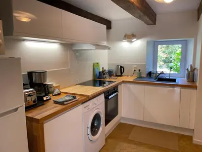 Cuisine ou kitchenette dans l'établissement Maison de caractère à 3km de la mer