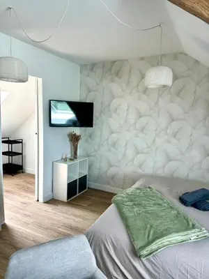 Un ou plusieurs lits dans un hébergement de l'établissement Suite Au grand air