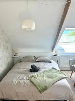 Un ou plusieurs lits dans un hébergement de l'établissement Suite Au grand air