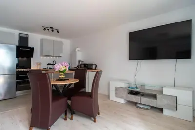 Cuisine ou kitchenette dans l'établissement L'Atlantic - Appt à moins 150m de la plage