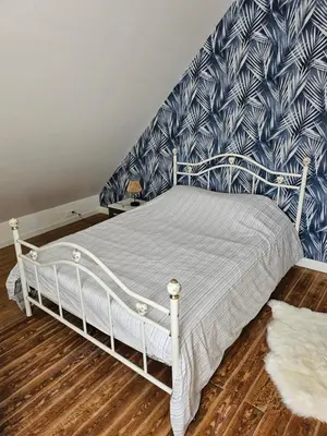 Un ou plusieurs lits dans un hébergement de l'établissement Authentique maison Morlaisienne