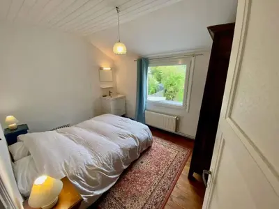 Un ou plusieurs lits dans un hébergement de l'établissement Ty Louise Maison de famille 10 pers bord de mer