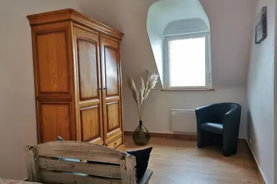 Coin salon dans l'établissement Grande maison spacieuse et lumineuse tout confort