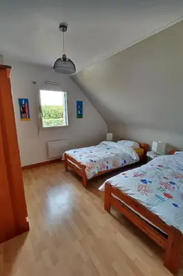 Un ou plusieurs lits dans un hébergement de l'établissement Grande maison spacieuse et lumineuse tout confort