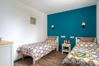 Un ou plusieurs lits dans un hébergement de l'établissement Le Tamm Bara - Appt avec piscine partagée
