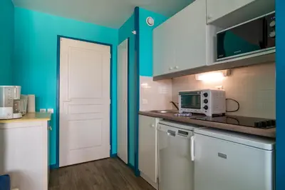 Cuisine ou kitchenette dans l'établissement Le Tamm Bara - Appt avec piscine partagée