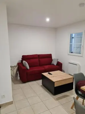 Coin salon dans l'établissement Maison de vacances