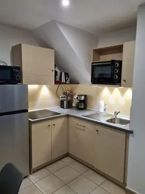 Cuisine ou kitchenette dans l'établissement Maison de vacances