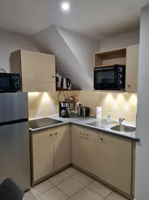 Cuisine ou kitchenette dans l'établissement Maison de vacances