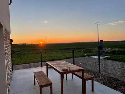 Lever ou coucher de soleil vu de la maison de vacances ou à proximité