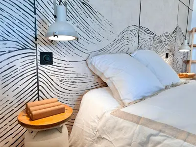 Un ou plusieurs lits dans un hébergement de l'établissement Au Bon Accueil - Appartement vue mer - Hyper centre - Avec Home-Cinéma