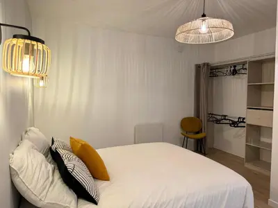 Un ou plusieurs lits dans un hébergement de l'établissement Appartement Cosy en Centre-Ville