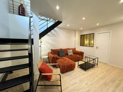 Coin salon dans l'établissement Appartement Cosy en Centre-Ville