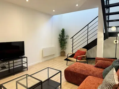 Télévision ou salle de divertissement dans l'établissement Appartement Cosy en Centre-Ville