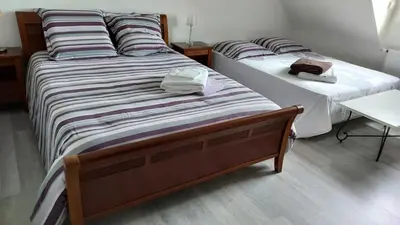 Un ou plusieurs lits dans un hébergement de l'établissement VILLA FAMILIALE Bord de Mer