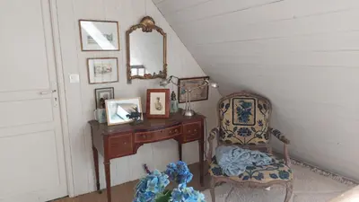 Coin salon dans l'établissement Longere ancienne dans un parc