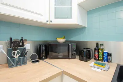 Cuisine ou kitchenette dans l'établissement Ty Loan I Hyper centre & Balcon
