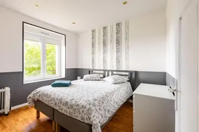 Un ou plusieurs lits dans un hébergement de l'établissement Maison tout confort 10 personnes - La Halte Bigoudene