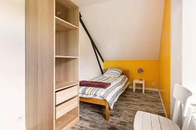 Un ou plusieurs lits dans un hébergement de l'établissement Maison tout confort 10 personnes - La Halte Bigoudene