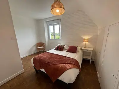 Un ou plusieurs lits dans un hébergement de l'établissement Ty Loho - Grande maison à Landéda