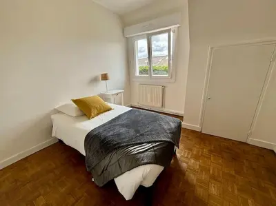 Un ou plusieurs lits dans un hébergement de l'établissement Ty Loho - Grande maison à Landéda