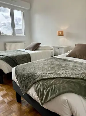 Un ou plusieurs lits dans un hébergement de l'établissement Ty Loho - Grande maison à Landéda