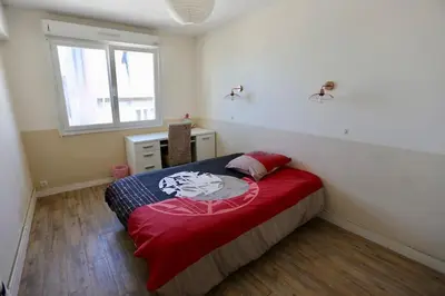 Un ou plusieurs lits dans un hébergement de l'établissement Joli appartement Centre-ville